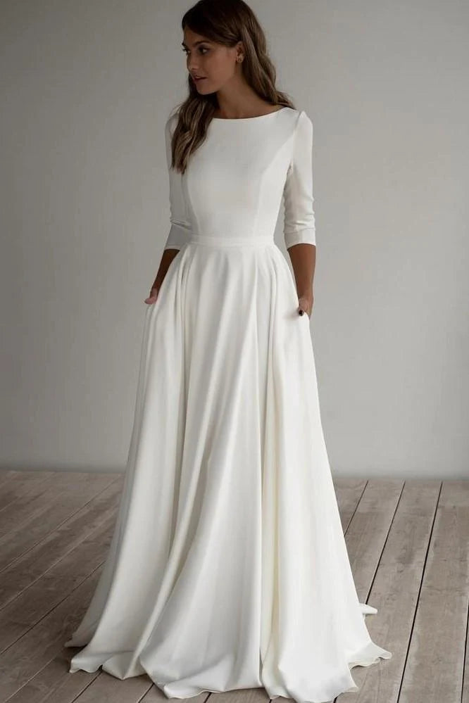 Robe de mariée trapèze simple, longueur au sol, manches 34, en satin, avec poches 