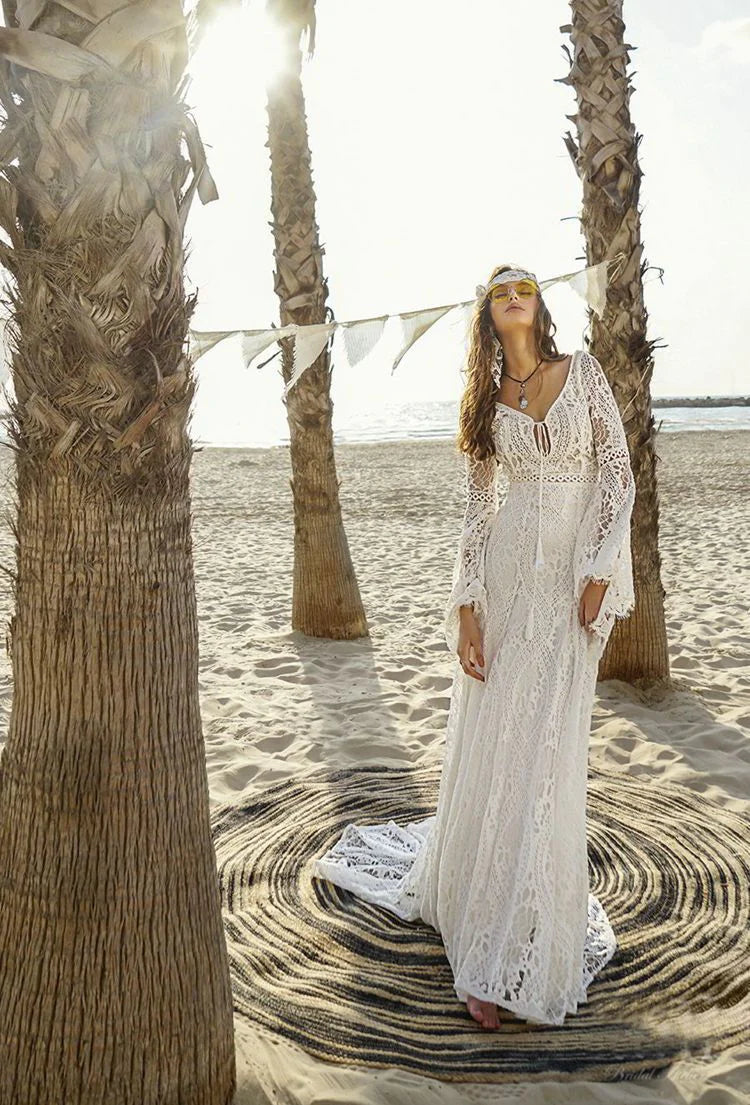 Robe de mariée sirène dos nu en dentelle style bohème à manches bouffantes et traîne