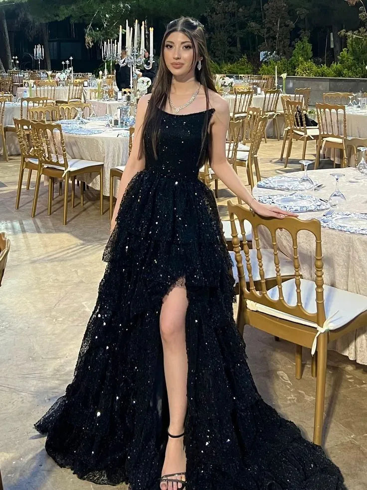 Front view of the black sequin prom dress, focusing on the strapless sweetheart neckline and fitted bodice.