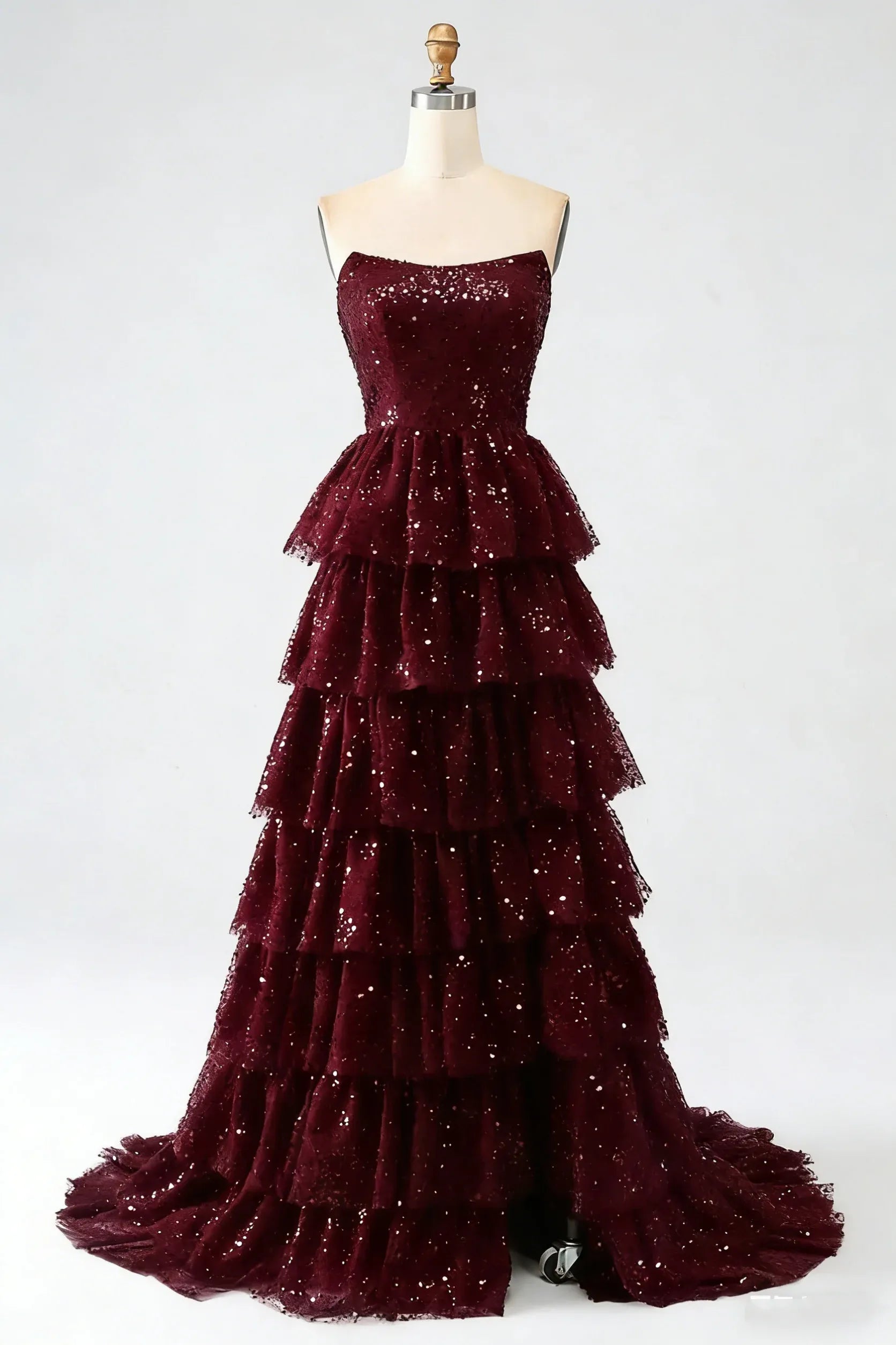 Full length view of a model in the sparkling black sequin prom dress with a floor-length silhouette.
