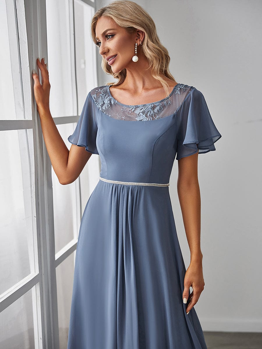 Side view of a model wearing a dark blue Weitese A-line midi dress.