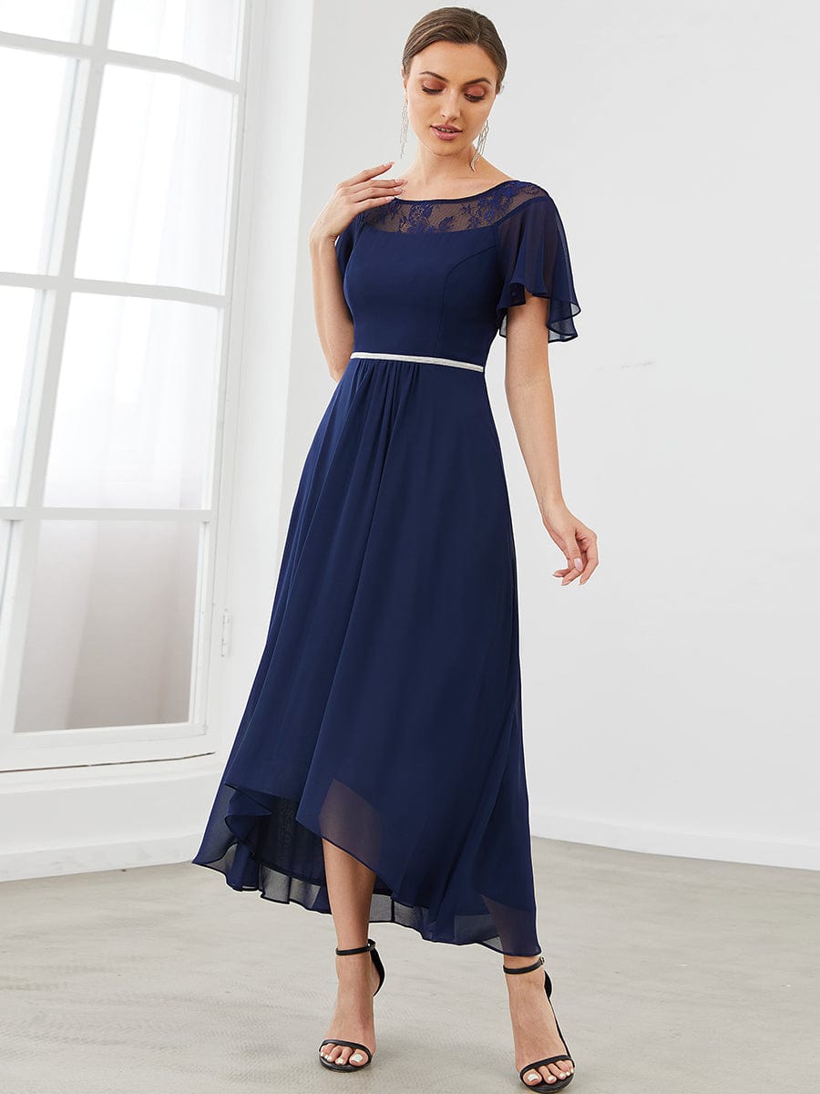 Model wearing a navy blue Weitese A-line midi dress with boat neck and asymmetrical hem.