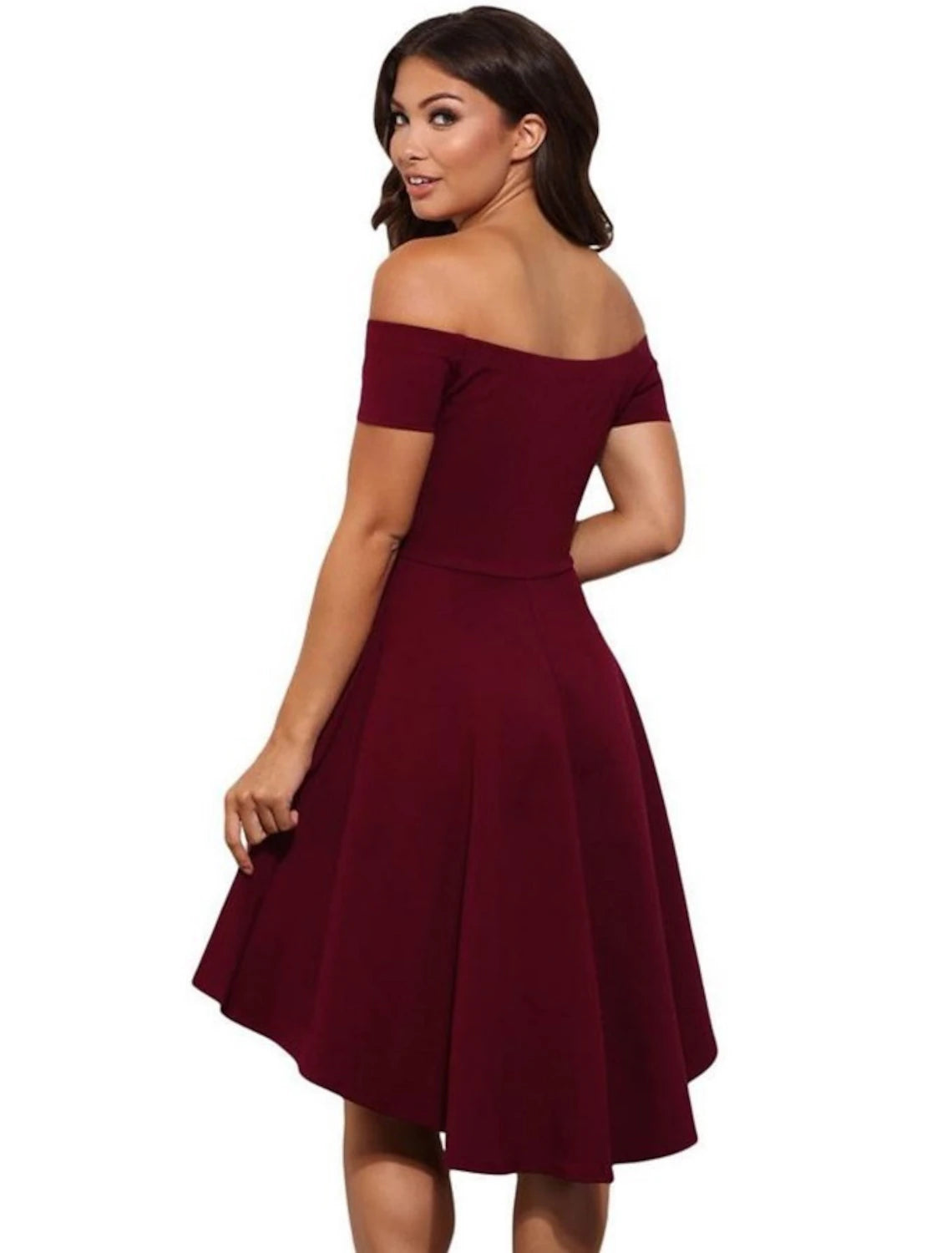Side view of a woman in a light pink A-line off-shoulder mini dress.