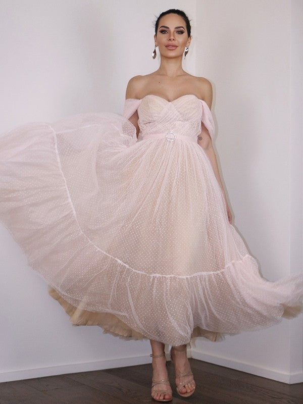Close-up of the lace and ruched details on the Weitese off-shoulder dress.