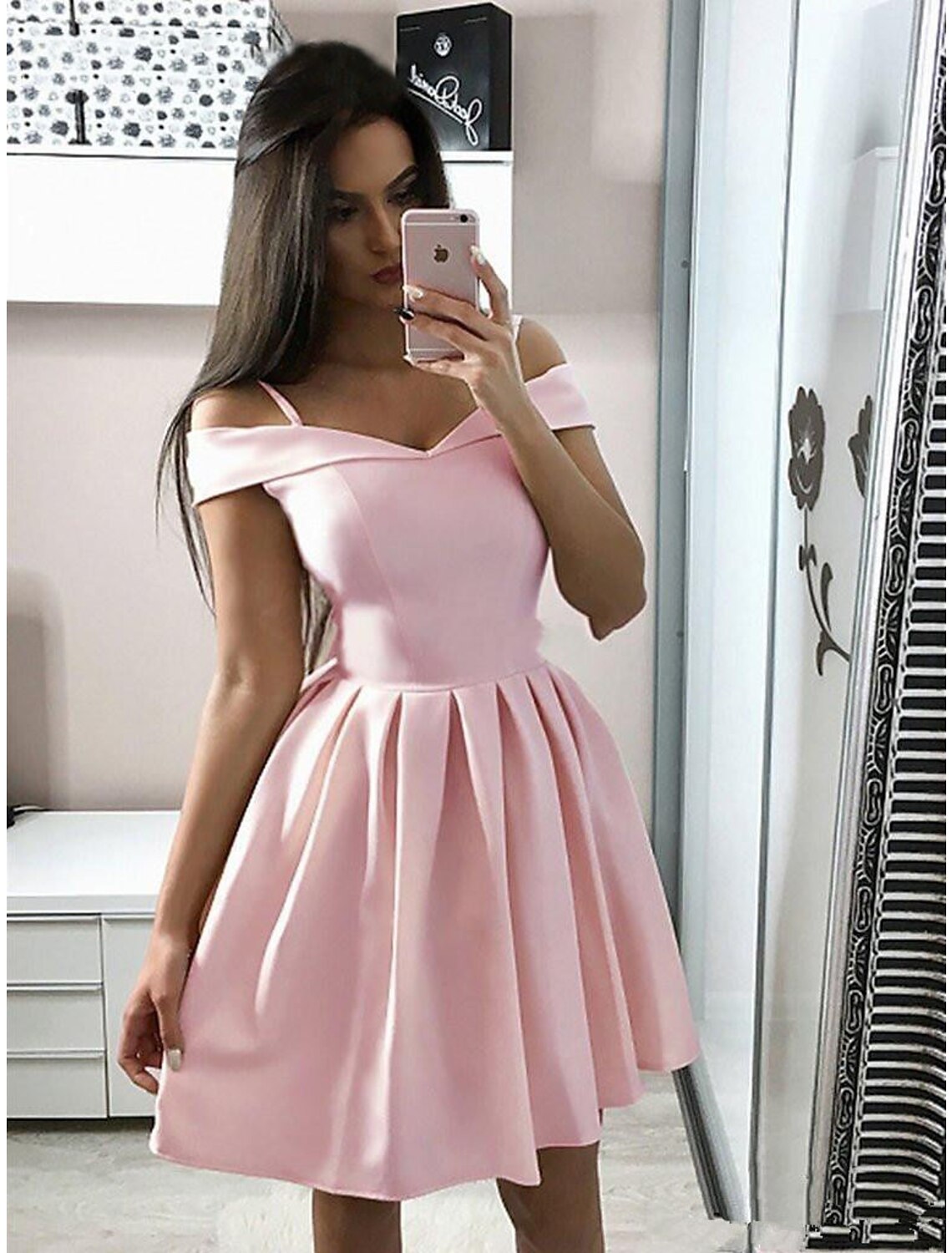 Model wearing a pink A-line V-neck knee-length cocktail dress with pleats.