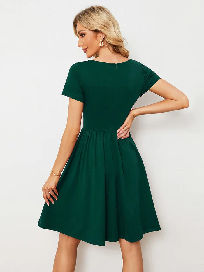Model showcasing the short sleeves and flowy fit of the Weitese summer dress.