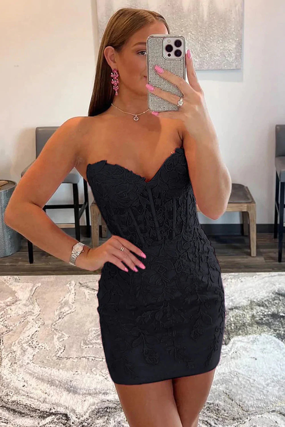 Model posing in the hot pink bodycon dress.