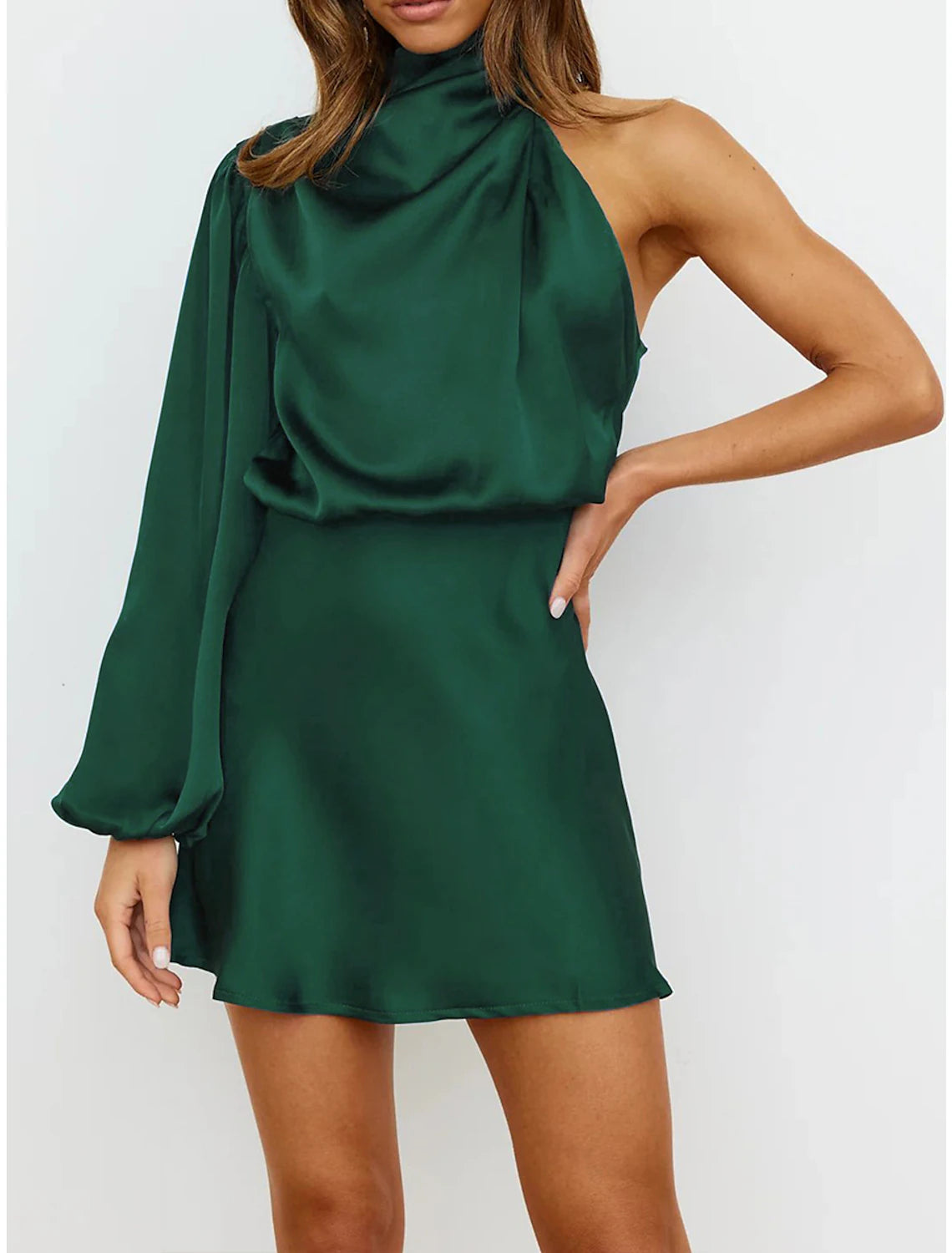 Woman wearing a light green high neck long sleeve ruched satin mini dress.