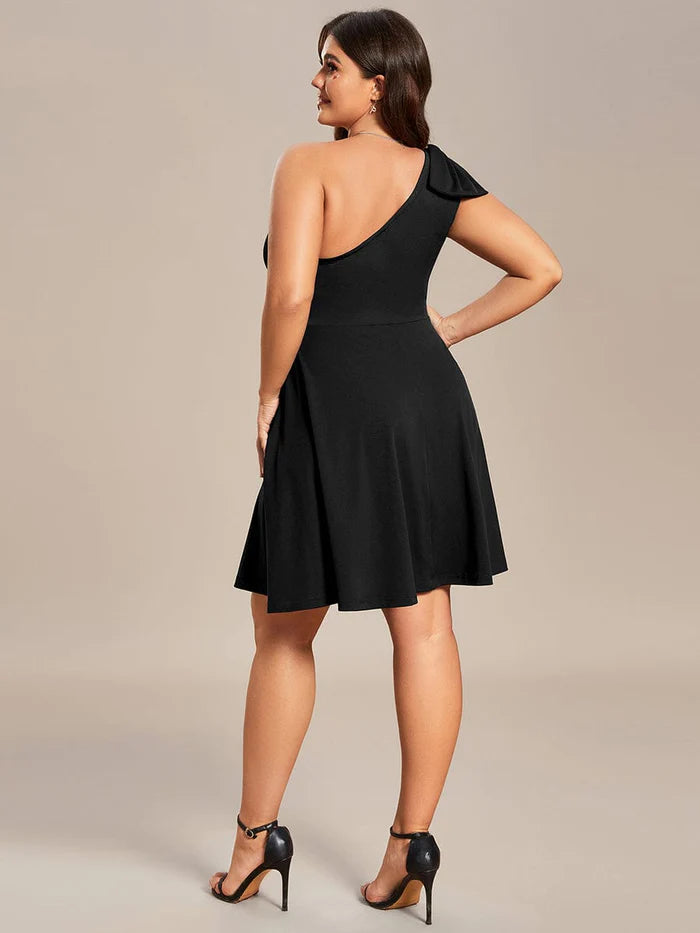 Model wearing a pink Weitese one-shoulder mini dress with a bowknot, side view.