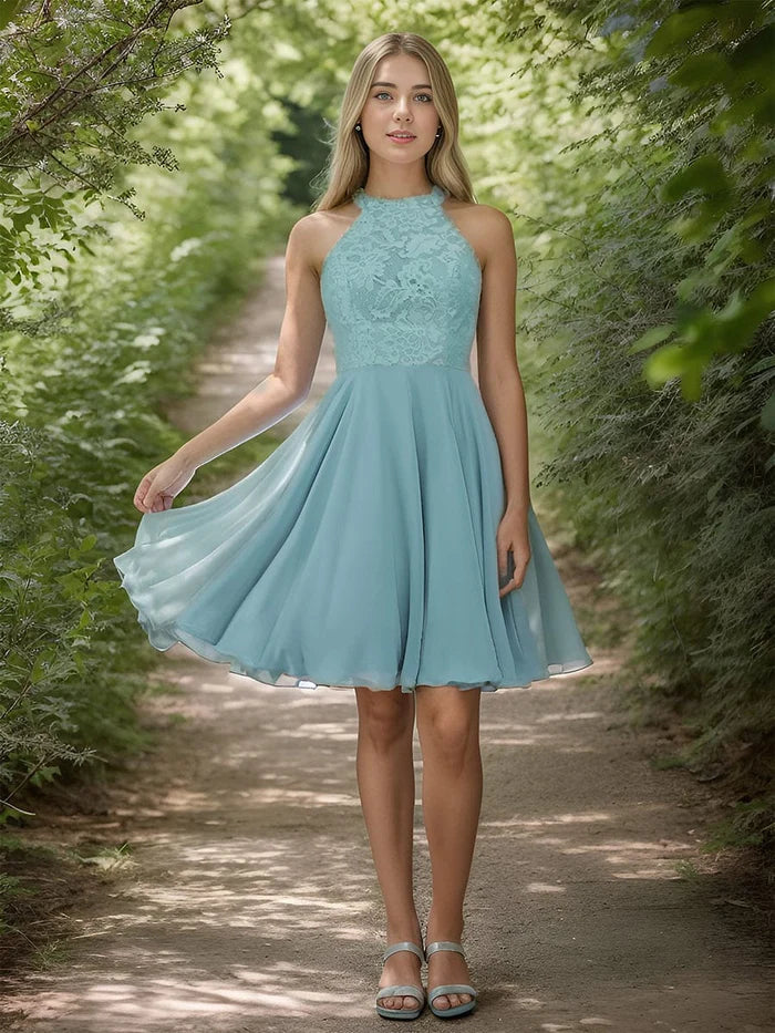 Model wearing a light blue short lace halter neck backless chiffon homecoming dress, front view.