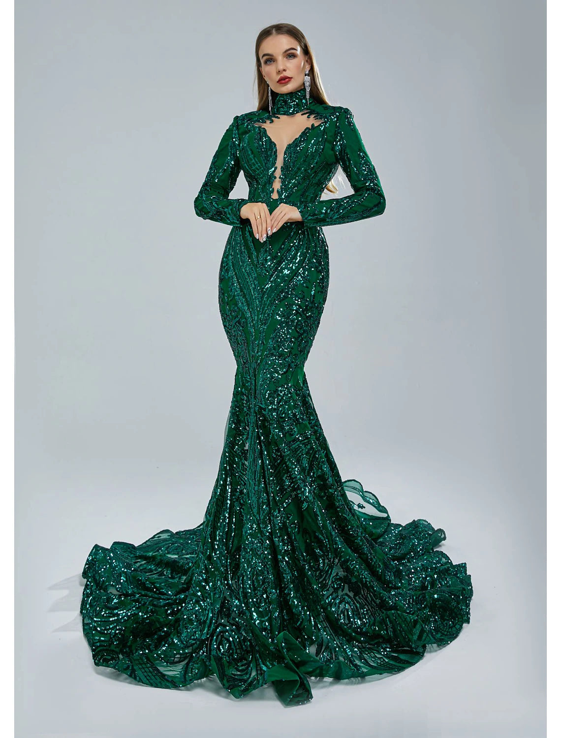 Woman wearing a red sequin mermaid evening gown with long sleeves and a stand collar.