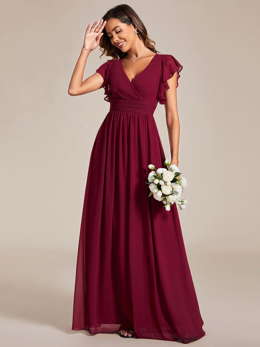 Back view of a burgundy A-line chiffon bridesmaid dress, showing the cutout detail.