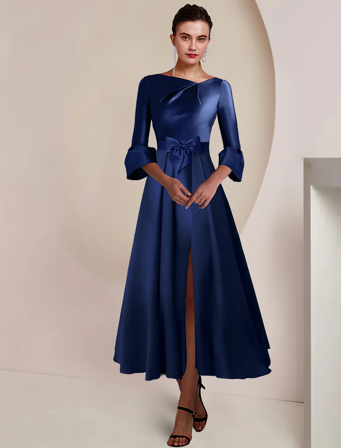 Elegant A-Line satin tea length dress with bateau neck and 3/4 sleeves.