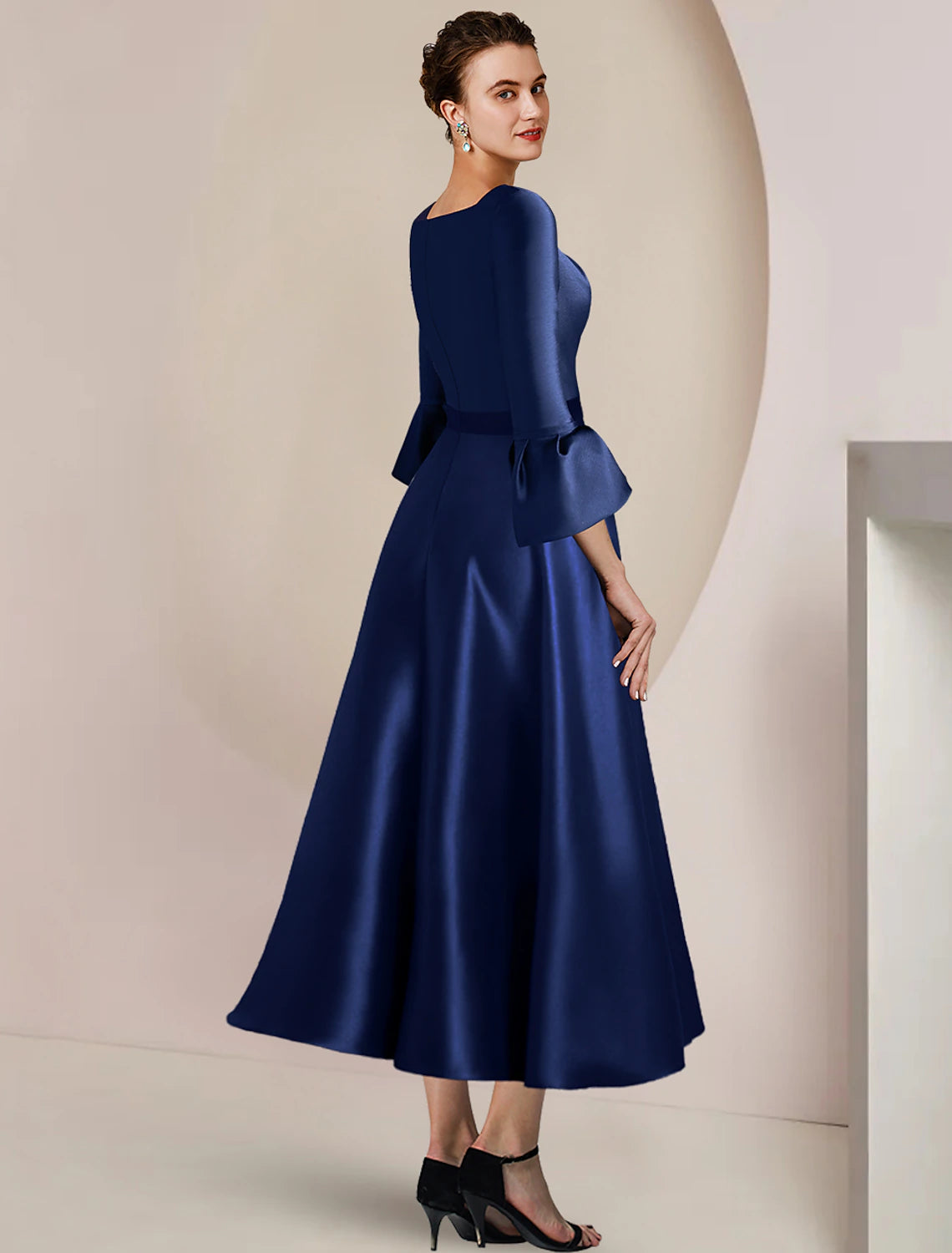 Side view of A-Line satin dress, highlighting the split front detail.