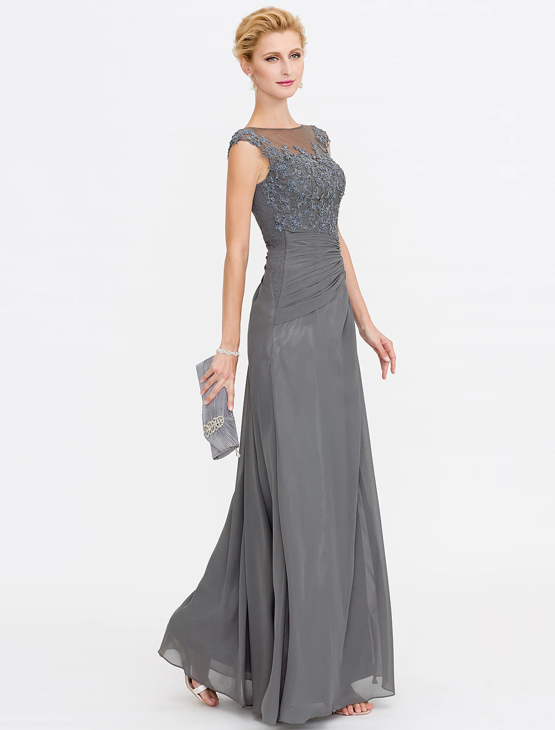 Back view of the elegant sleeveless gown with delicate lace details.