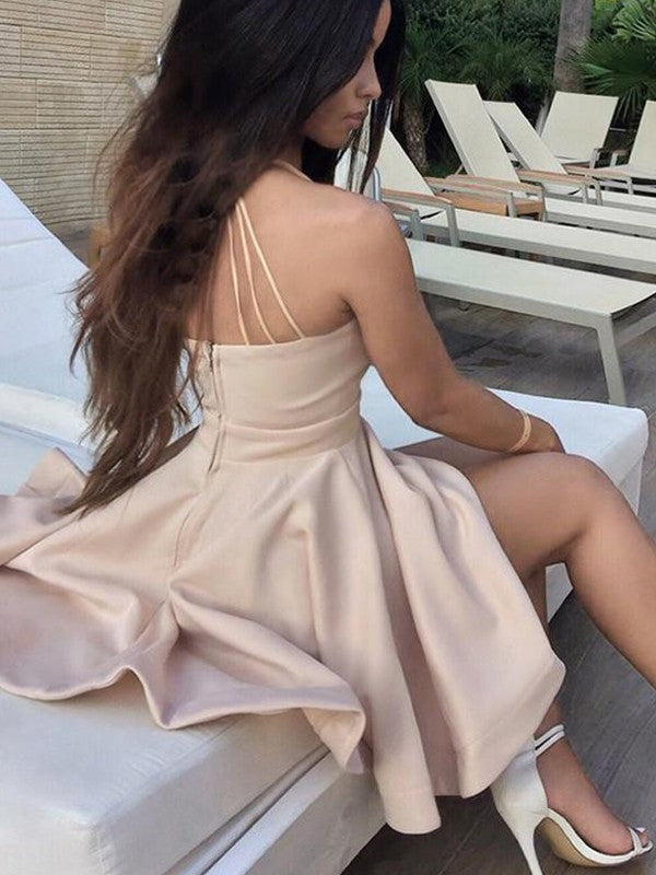 Close-up of the elegant white charmeuse ruffle mini dress with delicate spaghetti straps.