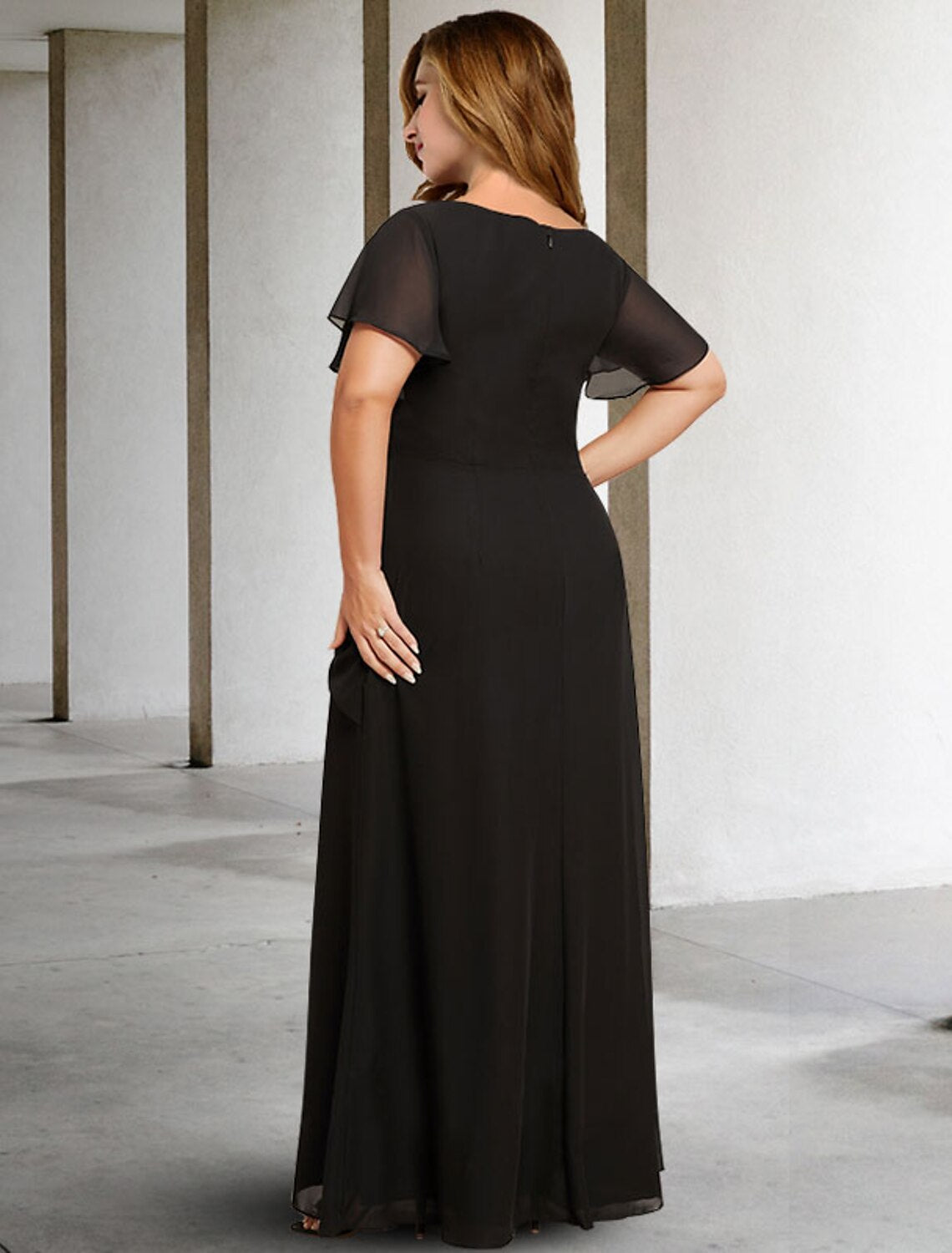 Close-up of the jewel neck and ruched bodice on a dark blue A-line formal dress.