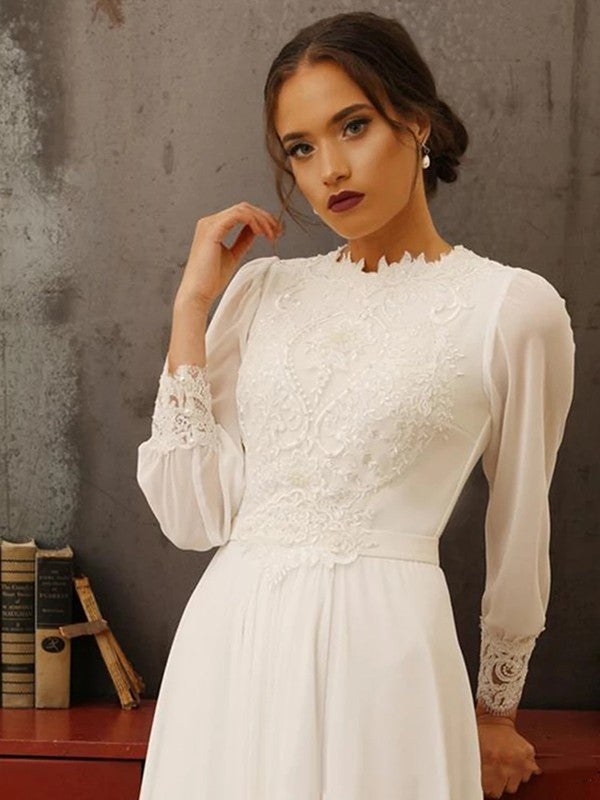 Close-up of the lace bodice and long sleeves on a Weitese wedding dress.
