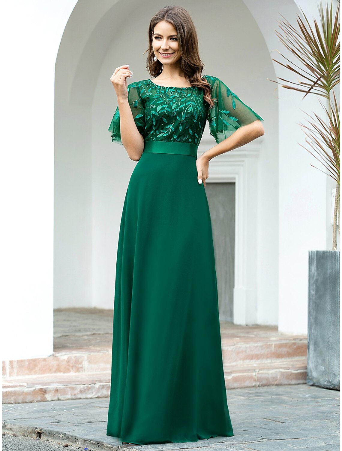 Elegant A-Line chiffon prom dress with jewel neck and short sleeves.