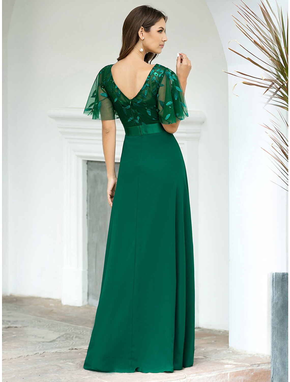 Back view of A-Line chiffon dress featuring a sequin V-back.
