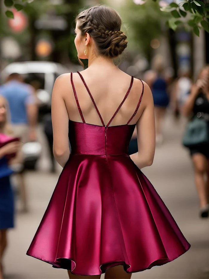 Close-up of the bodice of the Weitese satin dress, highlighting double spaghetti straps and sparkling rhinestones.