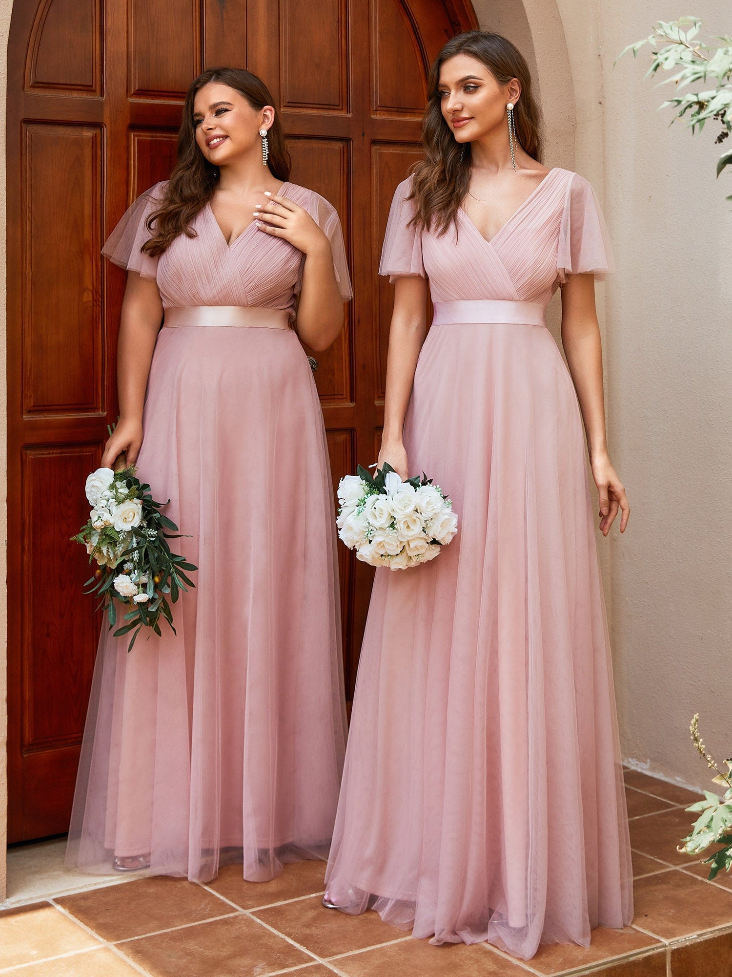Woman in a pink double V-neck tulle bridesmaid dress.