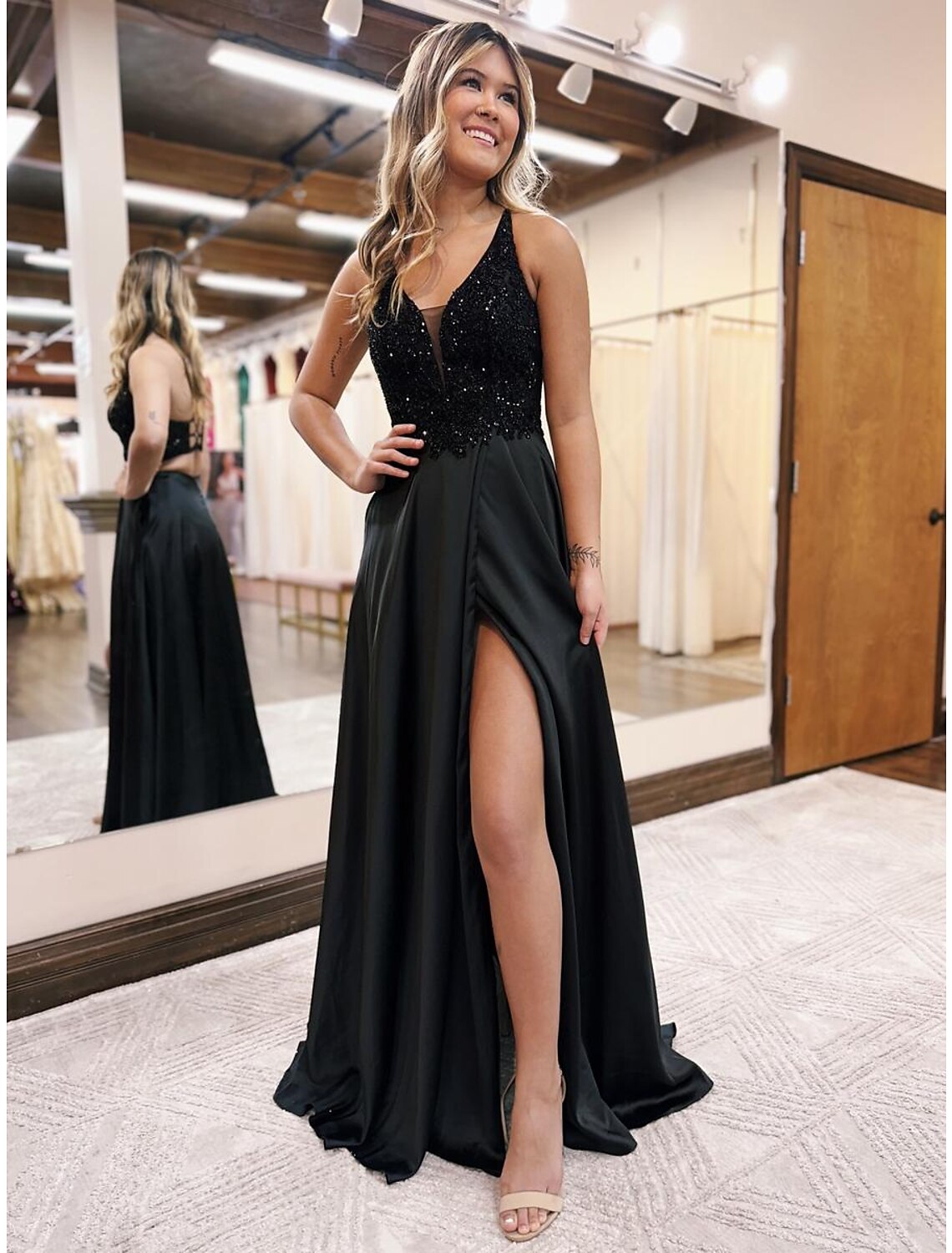 Detailed view of the V-neck and beading appliques on the Weitese evening gown.