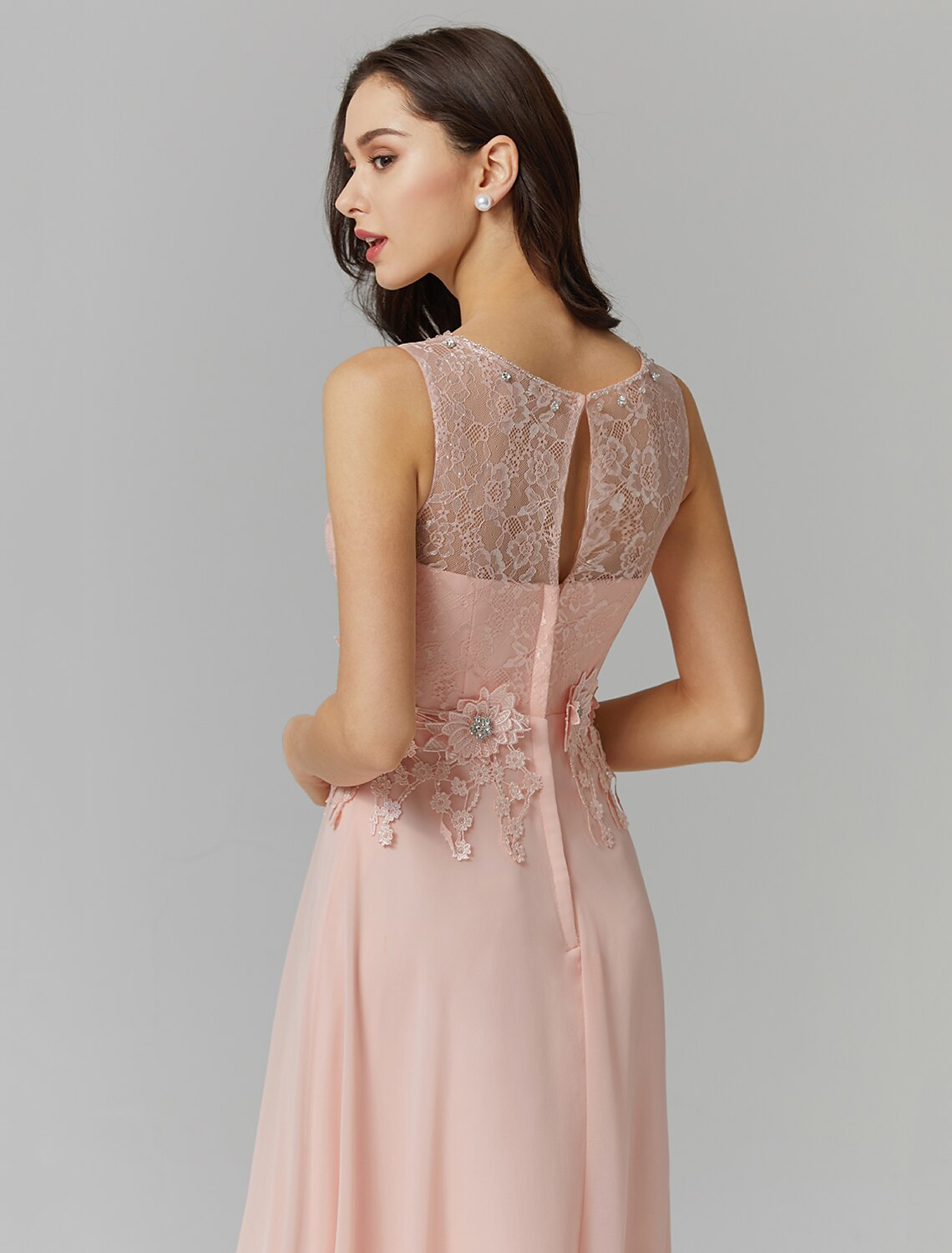Close-up of the illusion neckline and beaded details on the dress.