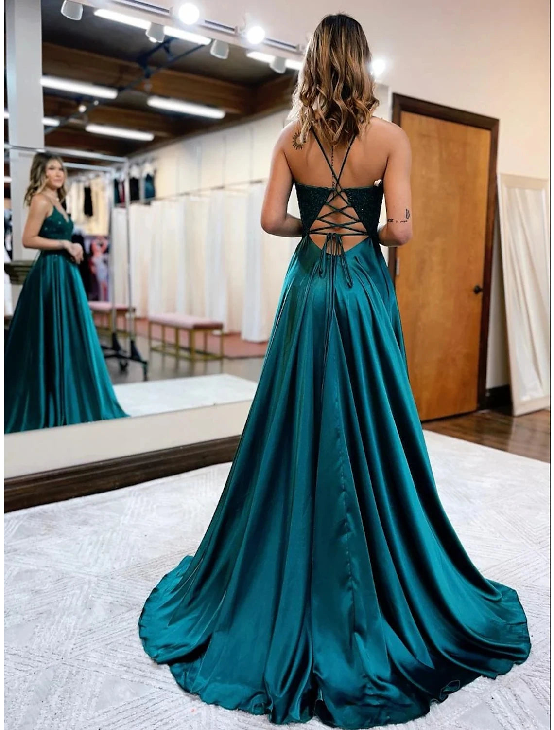 Full-length view of the A-line empire prom dress, showcasing the flowing satin and court train.