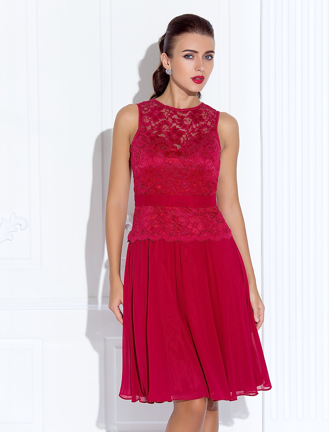 Back view of the blue A-line cocktail dress showing lace details.