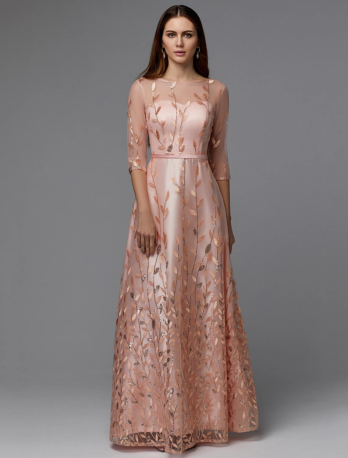 Model wearing an elegant A-line floral lace dress with illusion neck and 3/4 sleeves.