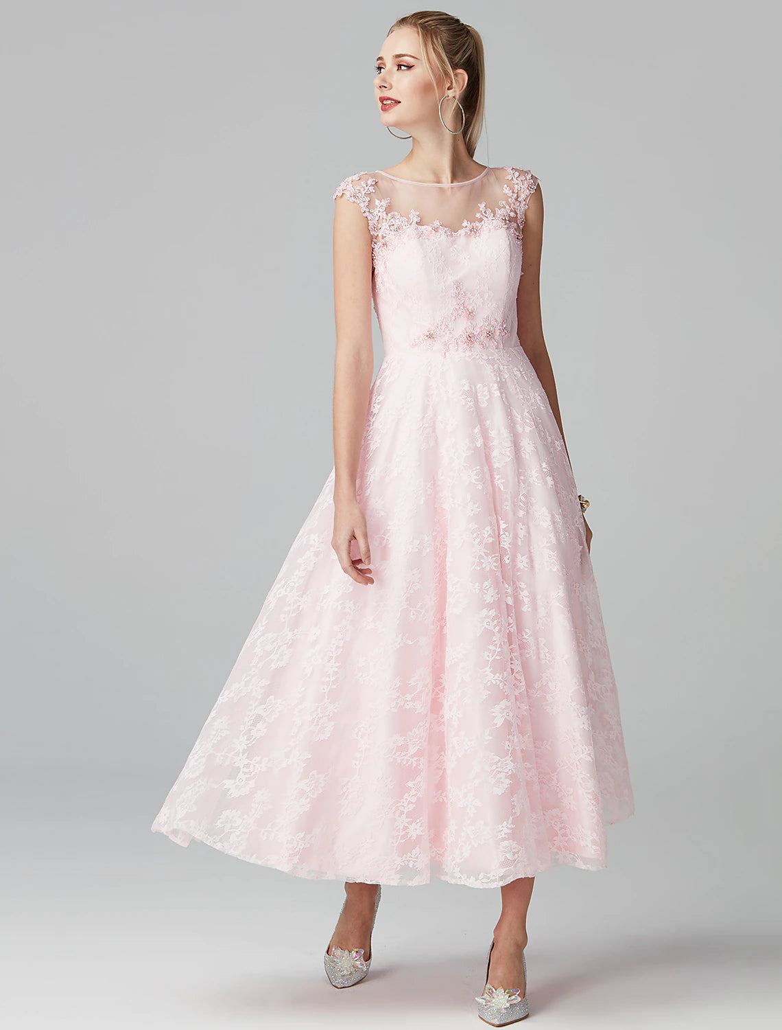 Close-up of illusion neckline and floral lace details on the dress.