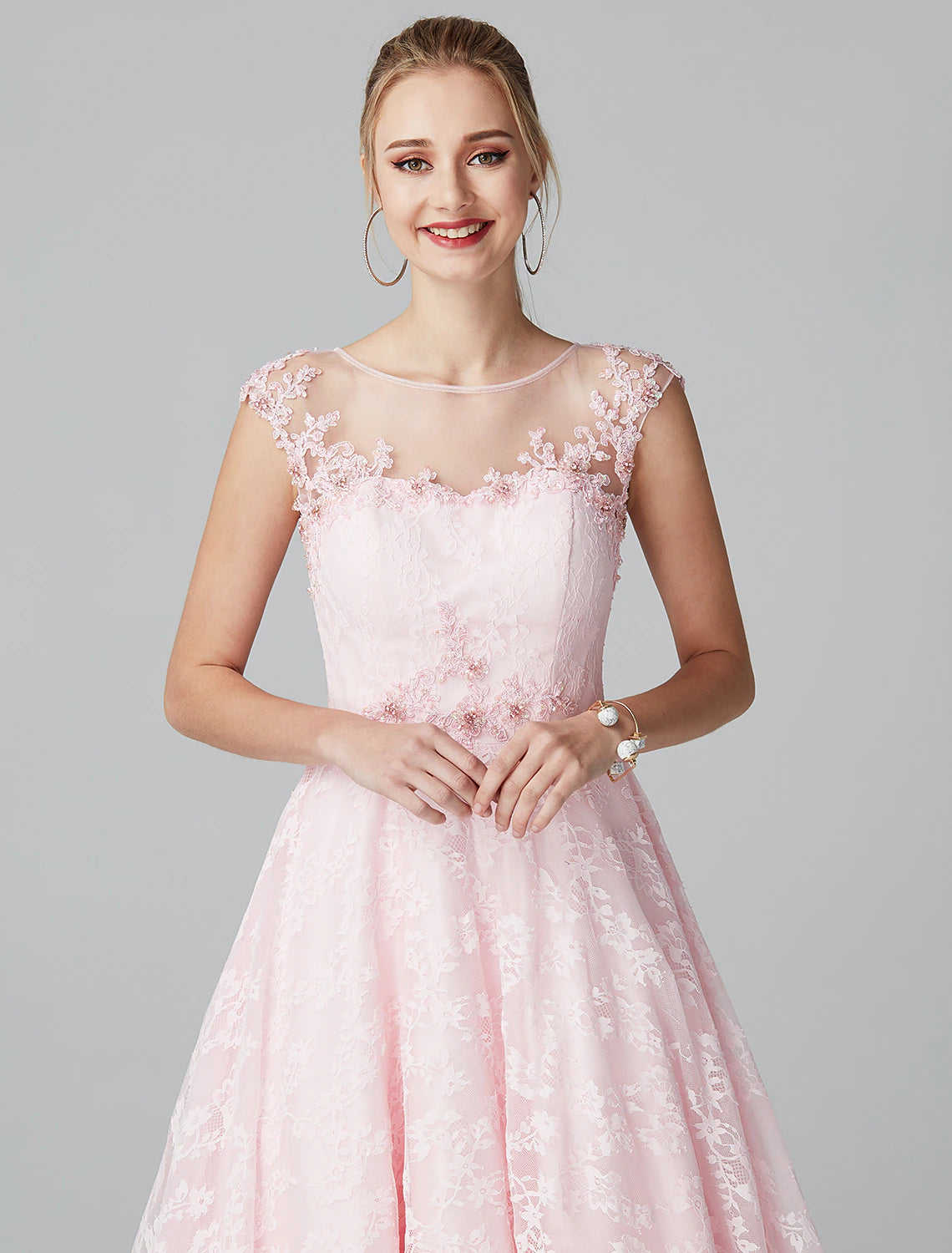 Model gracefully posing in Weitese floral lace evening gown.