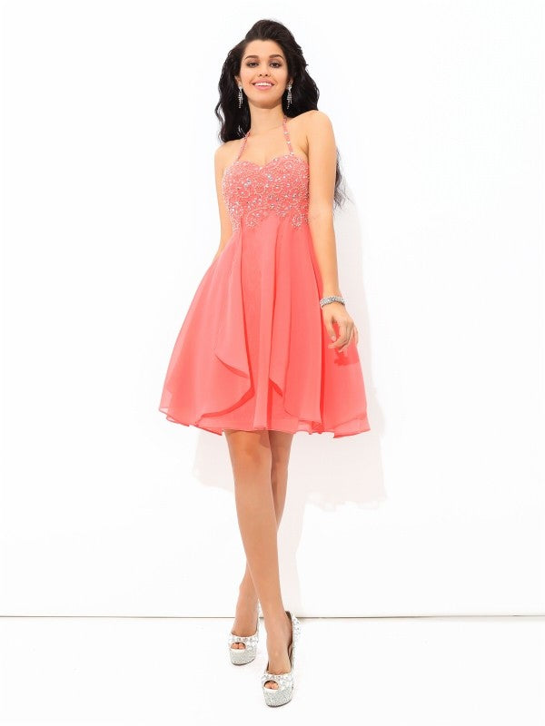 Back view of the short A-line chiffon cocktail dress worn by a model.