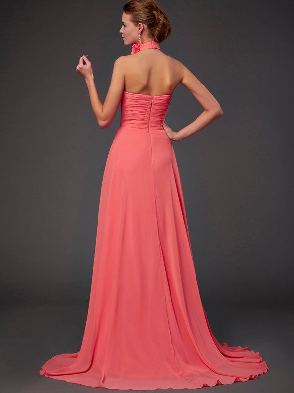 Close-up of halter neckline and hand-made flowers on chiffon dress.