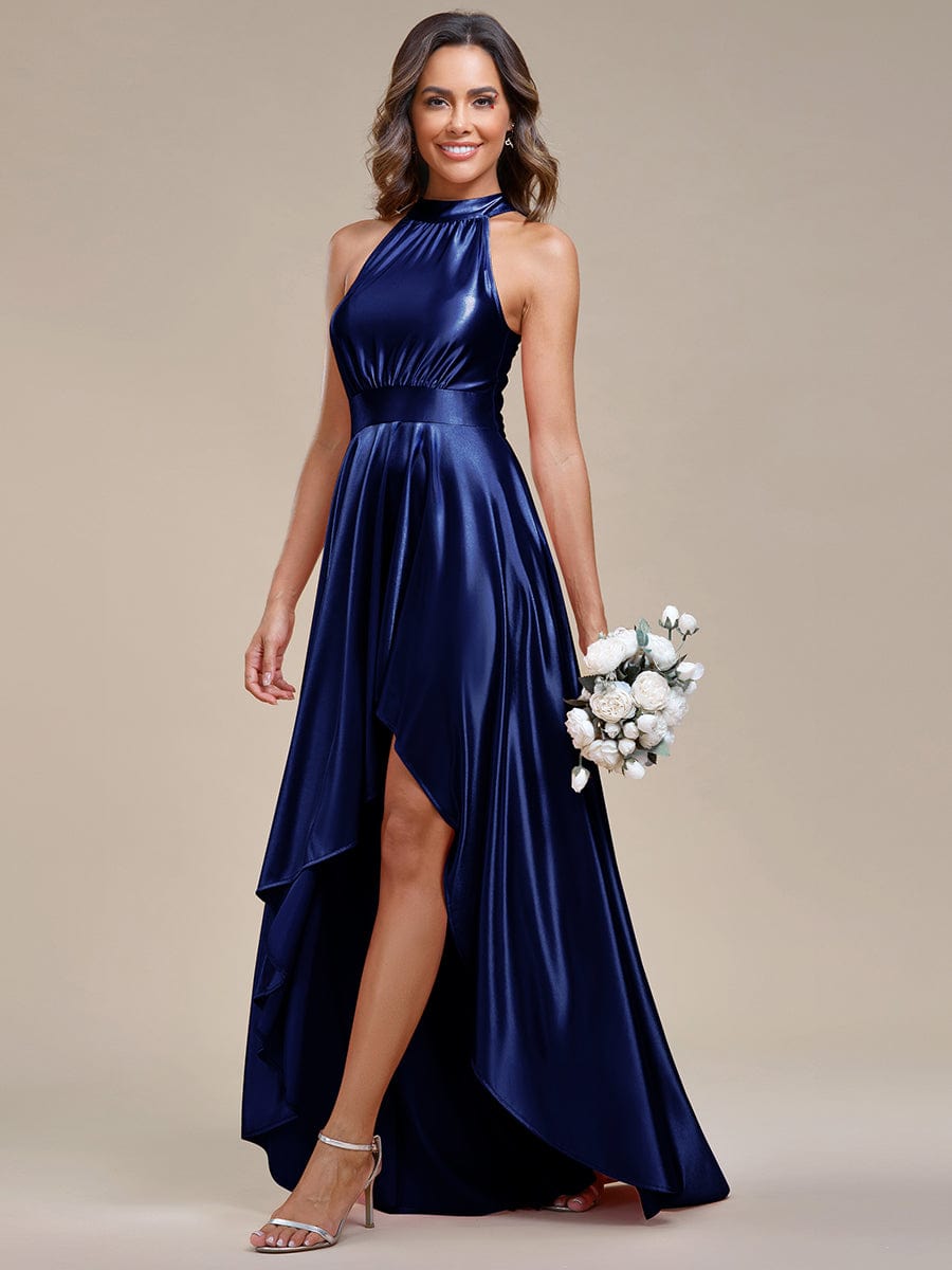 Close-up of the halter neckline and smooth satin fabric of the dress.