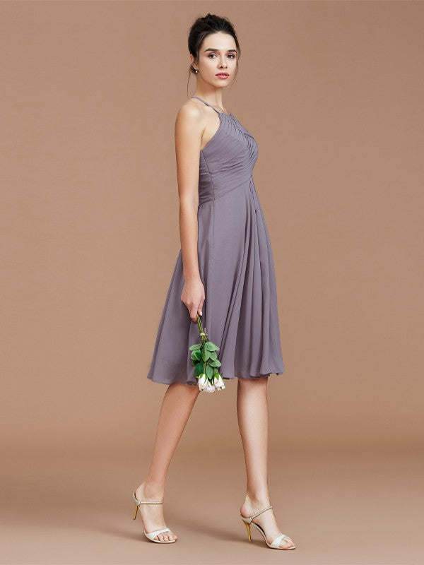 Side profile of a ruched halter mini bridesmaid dress.