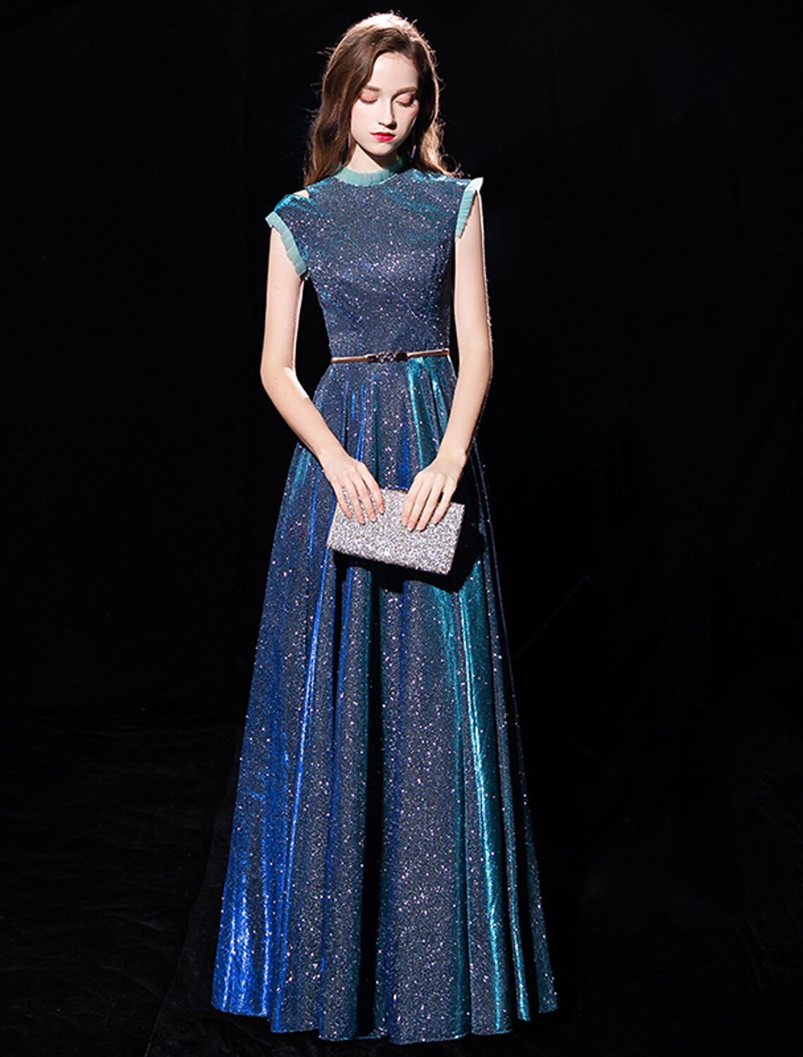 Side view of A-line high neck tulle gown.