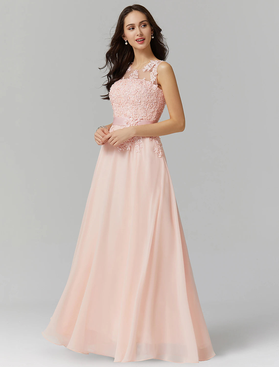 Model gracefully walking in the floor-length A-line evening gown.