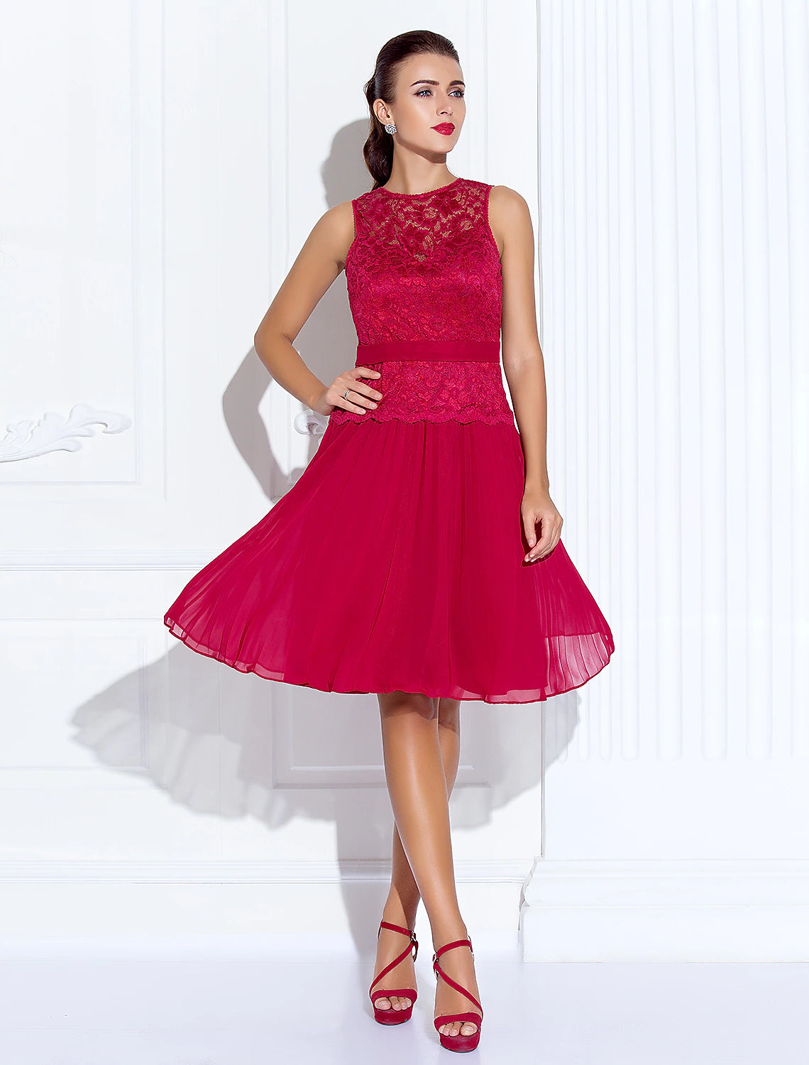 Back view of the A-line illusion neck lace and chiffon cocktail dress, showing lace details.