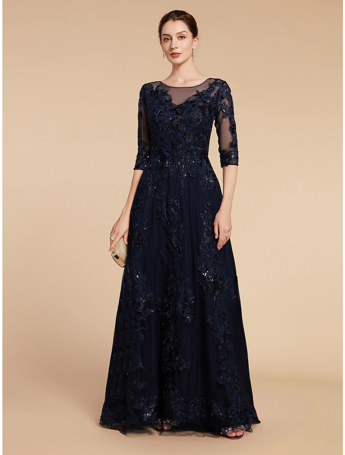 Elegant navy A-line mother of the bride dress with jewel neck and 3/4 sleeves, front view.