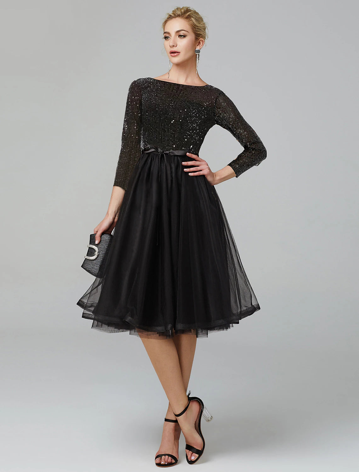 Elegant A-Line tea-length cocktail dress with 3/4 sleeves and sequin tulle detail.