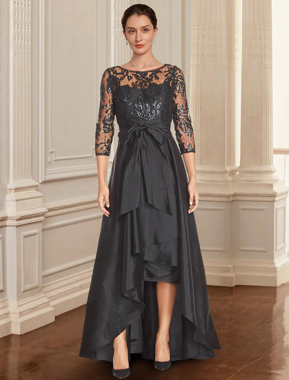 Elegant black A-line Mother of the Bride dress with jewel neck, 3/4 sleeves, lace, and sequin details.