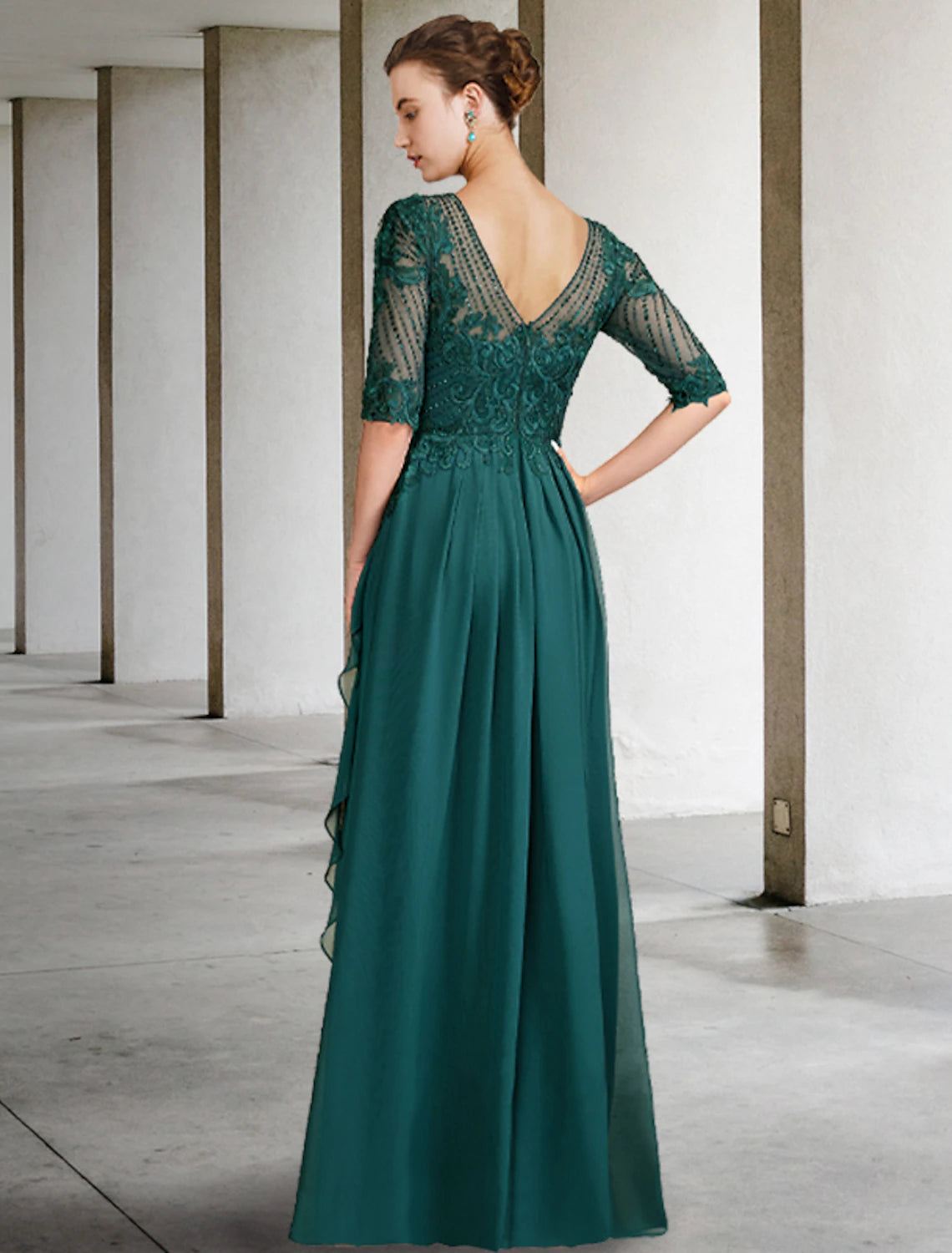 Side view of the chiffon lace Mother of the Bride gown featuring pleats.