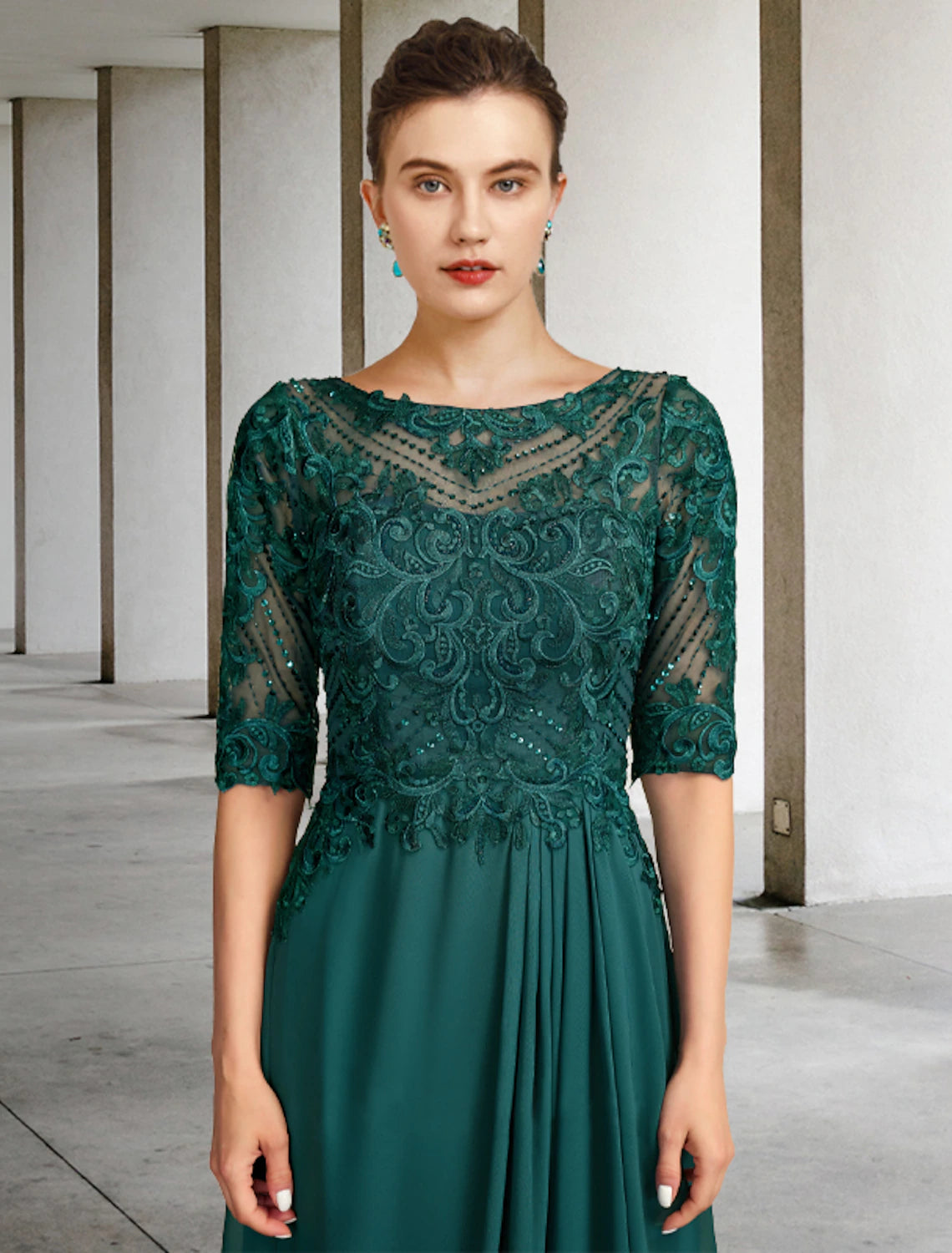 Back view of the floor-length formal dress adorned with beading and appliques.