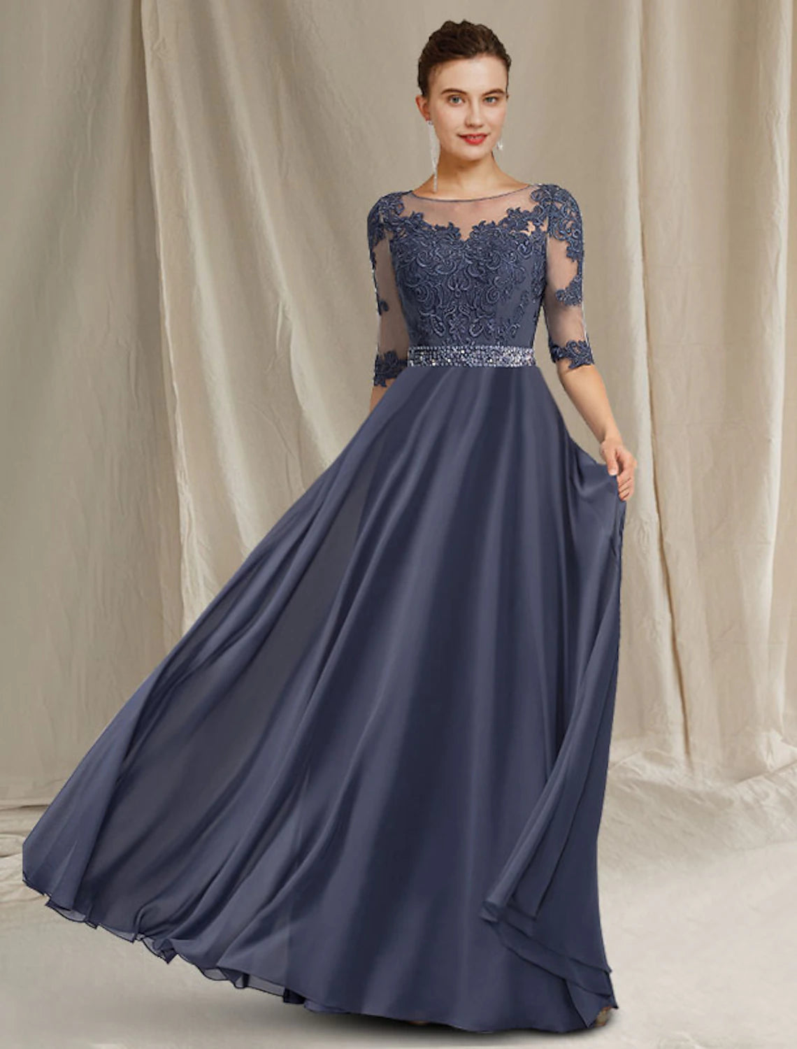 Elegant A-line mother of the bride dress with jewel neck and half sleeves, adorned with crystal appliques.