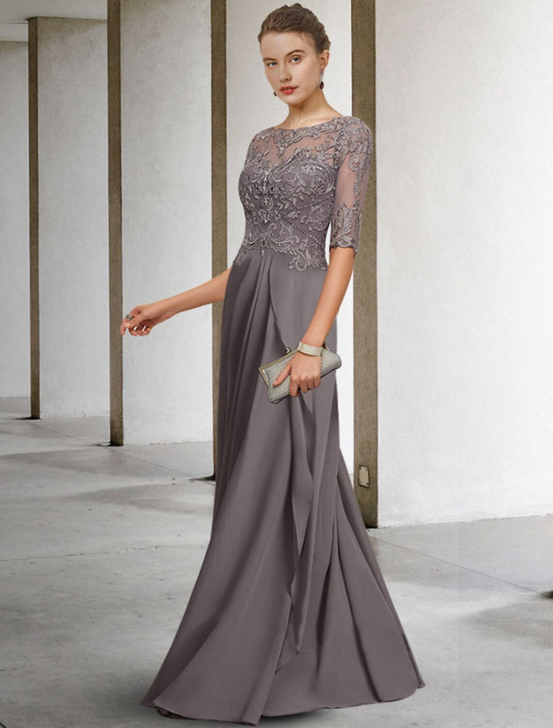 Close-up of the elegant Mother of the Bride dress, highlighting lace appliques and beading.