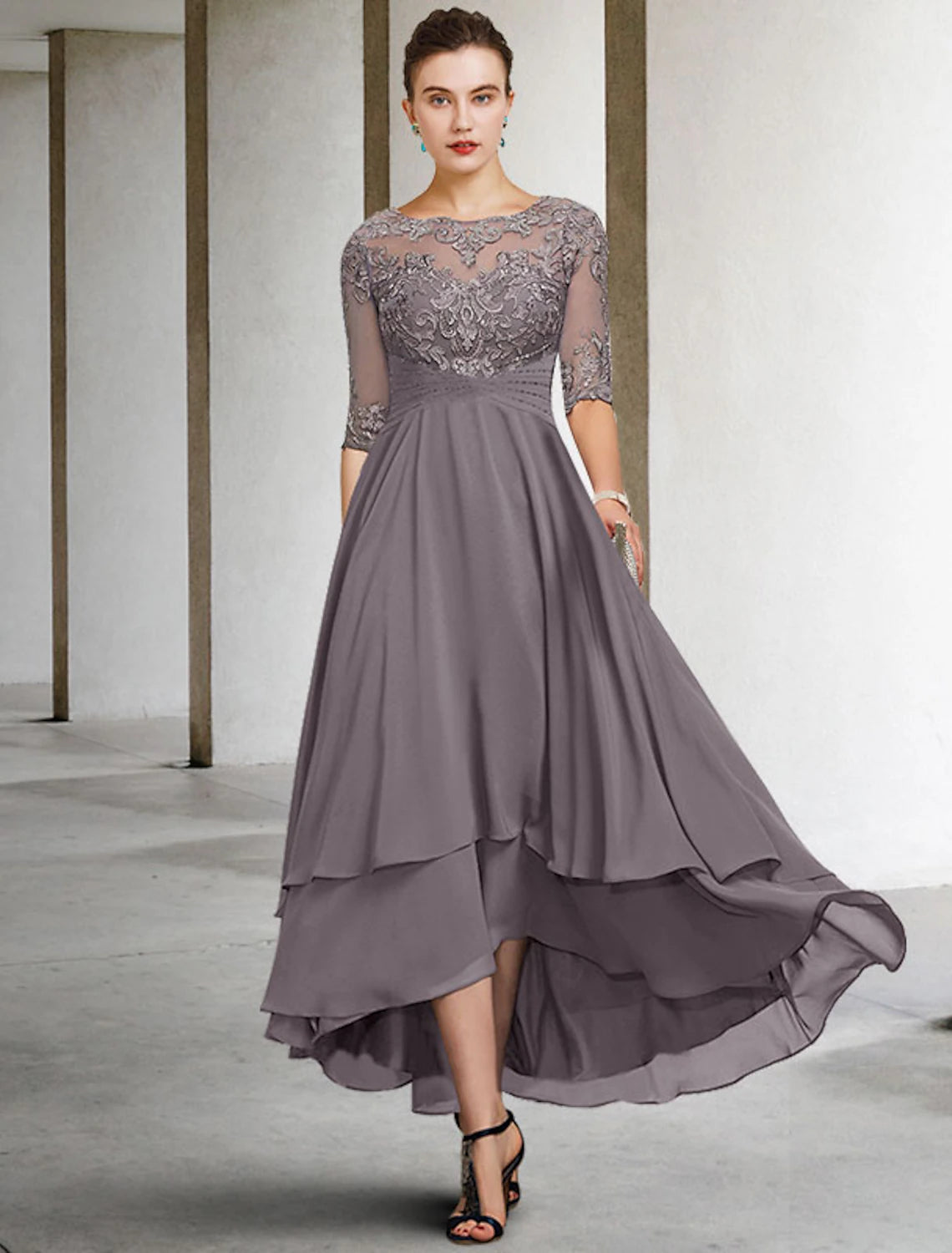 Elegant A-line mother of the bride dress with jewel neck and half sleeves.