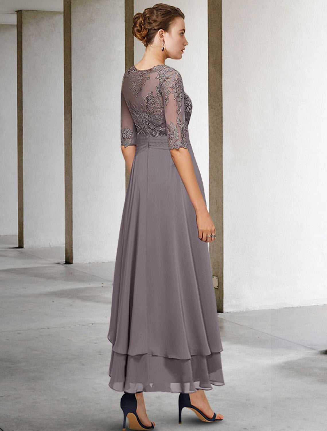 Close-up of the chiffon and lace fabric with intricate beading and appliques.