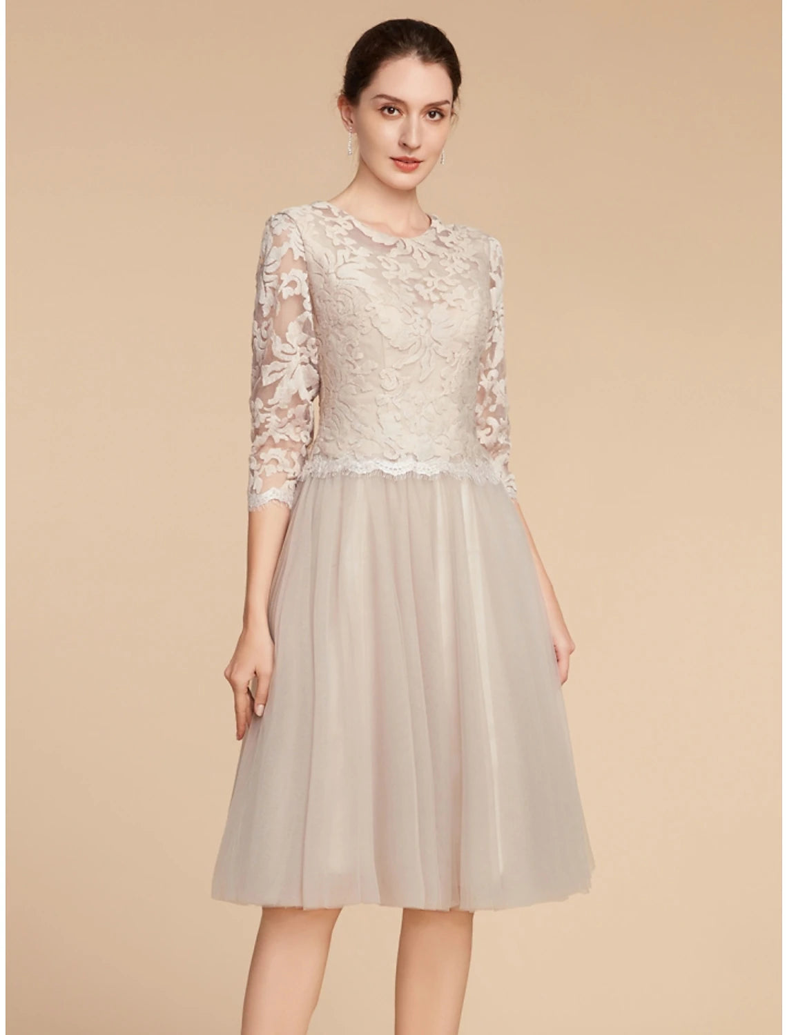 Elegant A-line lace tulle dress with jewel neck and half sleeves, front view.